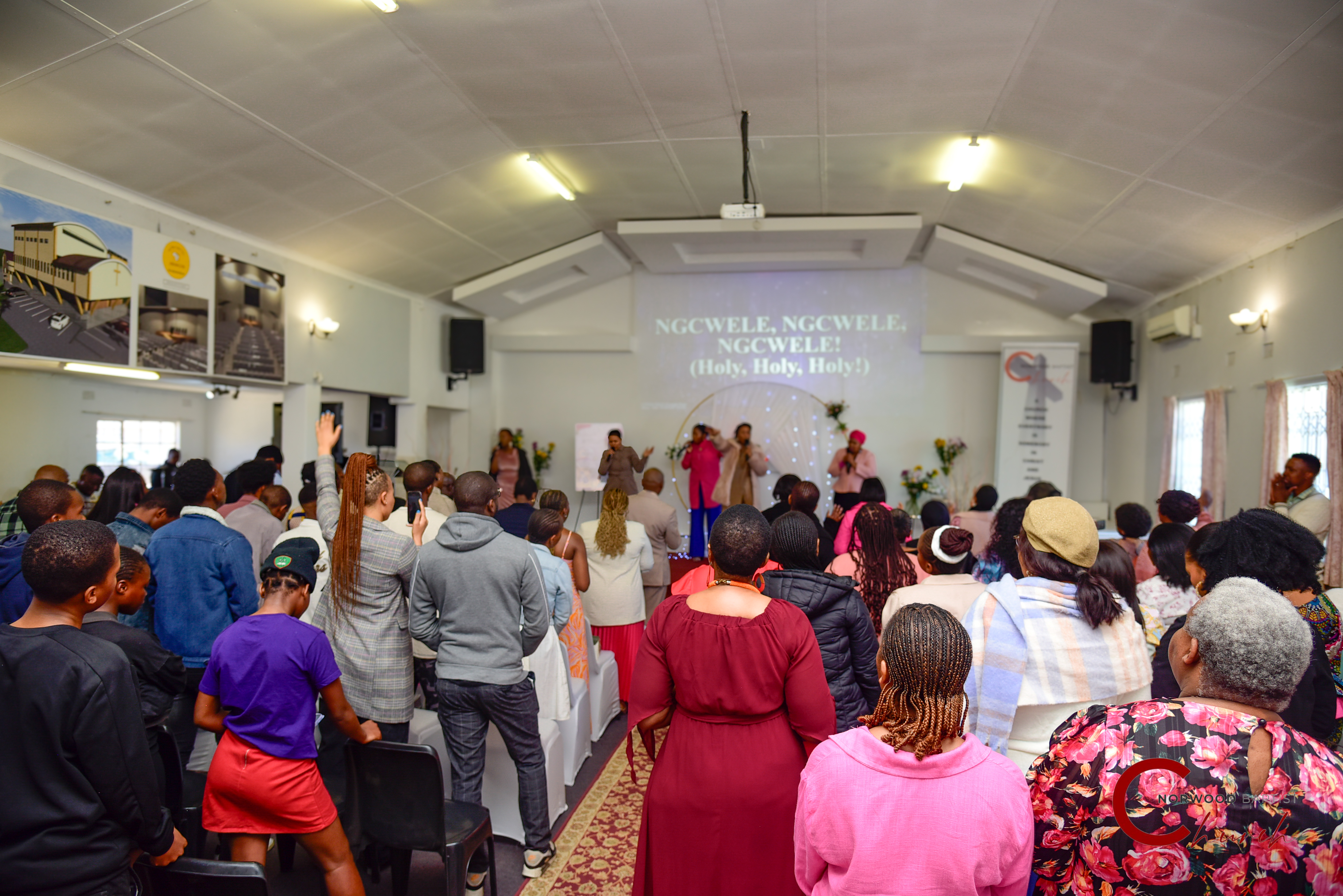 People raising hands in worship